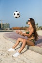 Young sexy woman in bikini play with ball on the beach Royalty Free Stock Photo