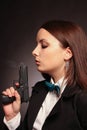 Young and woman holding a gun