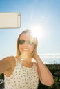 Woman is pointing with her finger to the sea from a balkony in summer holiday Royalty Free Stock Photo