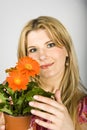 Young woman with orange flowers Royalty Free Stock Photo