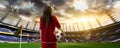 Young woman player in soccer stadium