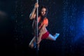 Young woman pole dancer. Water studio Royalty Free Stock Photo