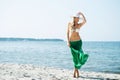 Young and woman posing in a hat on the beach Royalty Free Stock Photo