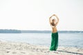 Young and woman posing in a hat on the beach Royalty Free Stock Photo