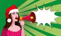 Young sexy woman in red hat Santa shouting in megaphon, loudspeaker. Female cartoon character announcing for advertising Royalty Free Stock Photo