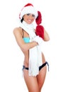 Young woman wearing bikini and christmas hat and gloves Royalty Free Stock Photo