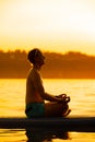 Girl family man woman are doing yoga on a sup Royalty Free Stock Photo