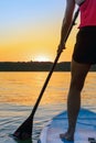 Girl family man woman are doing yoga on a sup Royalty Free Stock Photo