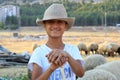 Turkish, Adiyaman, 24 July - 2019 : Young shepherd waiting for sheep.