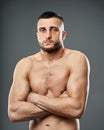 Athletic fighter posing on gray Royalty Free Stock Photo