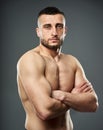 Athletic fighter posing on gray Royalty Free Stock Photo