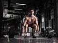 Young shirtless man doing deadlift exercise at the gym. Royalty Free Stock Photo