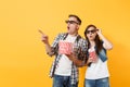 Young shocked couple woman man in 3d glasses watching movie film on date holding bucket of popcorn plastic cup of soda Royalty Free Stock Photo