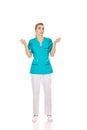 Young shocked nurse holding a drip Royalty Free Stock Photo