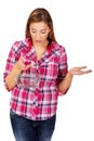 Young shocked woman holding small shopping basket Royalty Free Stock Photo