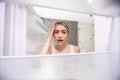 Young shocked woman looking in empty fridge at home Royalty Free Stock Photo