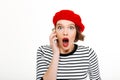 Young shocked woman talking by mobile phone Royalty Free Stock Photo
