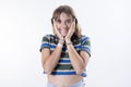 Young shocked woman on white background