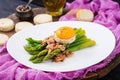 Young shoots of asparagus with ham and chicken egg yolk Royalty Free Stock Photo