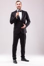 Young Showman presenter with microphone against white background.
