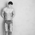 Young shredded man against a wall Royalty Free Stock Photo