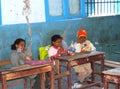 Young shy girls sitting on their disks at school in Egypt Royalty Free Stock Photo