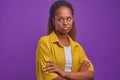 Young shy offended African American woman with arms crossed and pouting lips Royalty Free Stock Photo