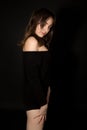 Young shy woman in black dress Royalty Free Stock Photo