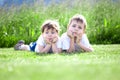 Young siblings on grass Royalty Free Stock Photo