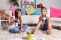 Young siblings watching TV Royalty Free Stock Photo