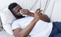 African-american man man has runny nose at home Royalty Free Stock Photo