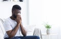 Young sick african man cleaning snotty nose Royalty Free Stock Photo