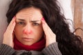 Young sick girl lying in bed with headache