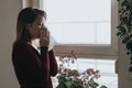 Young sick woman blowing her nose into a handkerchief Royalty Free Stock Photo