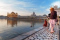 Young Sikh men visiting in Golden Temple in the early morning. Amritsar. India