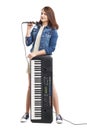 Young singer with microphone and synthesizer. Royalty Free Stock Photo