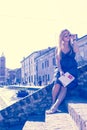 Young single female tourist in an old Italian town called Comacchio retro style filtered image Royalty Free Stock Photo