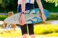 Young skateboard girl holding her longboard outdoors on sunset Royalty Free Stock Photo