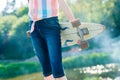 Young skateboard girl holding her longboard outdoors on sunset Royalty Free Stock Photo