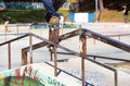Young skateboarder jumping on the railing in the skatepark Royalty Free Stock Photo