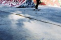 Young skateboarder skating inside of modern skatepark. Skateboard background Royalty Free Stock Photo