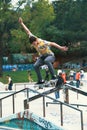 Young skateboarder training on the skate park in railing Royalty Free Stock Photo