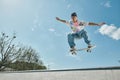 A young skater boy defies gravity Royalty Free Stock Photo