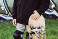 Young skater boy with an old skateboard Royalty Free Stock Photo