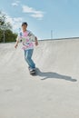 A young skater boy rides his Royalty Free Stock Photo