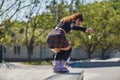 Young skater grinding on a ledge in a skatepark. Cool female roller blader in aggressive inline skates performing a ao pornstar