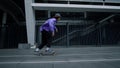 Young skater guy riding outside. Hipster enjoying extreme ride outdoors.