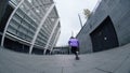 Young skater making trick at city street. Active guy falling during lesson.