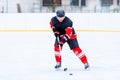 Young skater man in attack. Ice hockey game Royalty Free Stock Photo