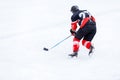 Young skater man in attack. Ice hockey game